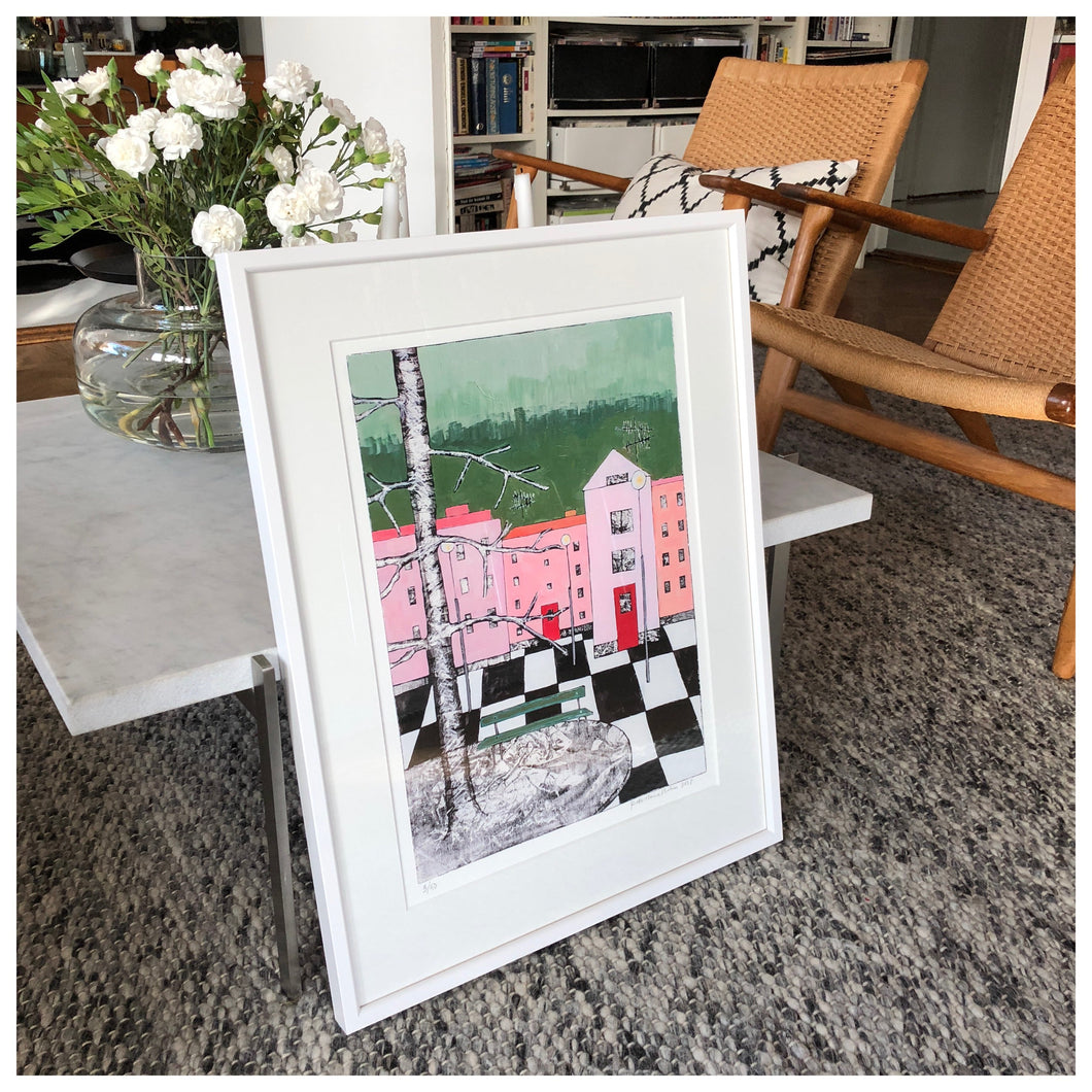 Stad med grön bänk