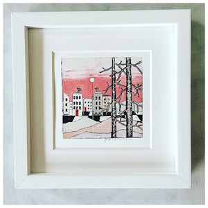 Stad med rosa himmel